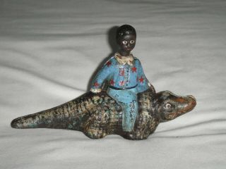 Antique Vintage Cast Iron Black Americana Boy Riding Alligator Swivel Head