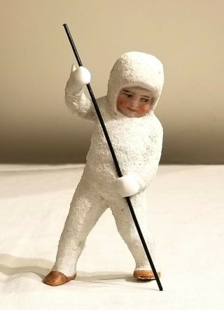 Miniature Bisque Snow Baby,  Standing & Holding.  Snow Covered.  Early 1900s German
