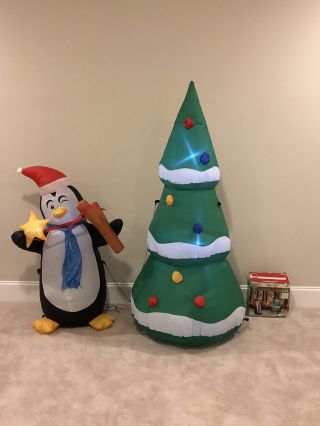 Gemmy Christmas Airblown Inflatable Penguin Slingshot Tree Two Pack Blow Up