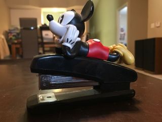 Mickey Laying Down On Top Of Black Stapler Walt Disney Mickey Mouse And Friends