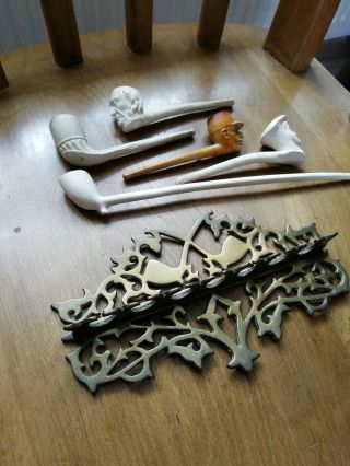Five Antique clay pipes including rare ' Motoring Girl ' pipe and brass stand 2