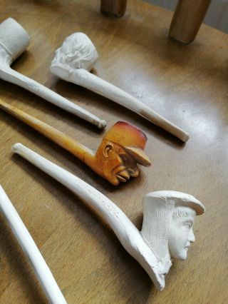 Five Antique clay pipes including rare ' Motoring Girl ' pipe and brass stand 3
