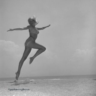 Bunny Yeager Photo Camera Negative Blonde Mod Pin - Up At Beach Kinetic Jump Pose