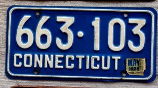 White On Blue Connecticut License Plate With A 1976 Sticker