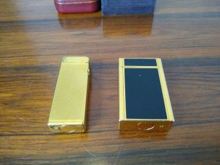 ST DUPONT LIGHTER LINE 1 LARGE GOLD LACQUER & DUNHILL ROLLAGAS GOLD.  BOXED. 3