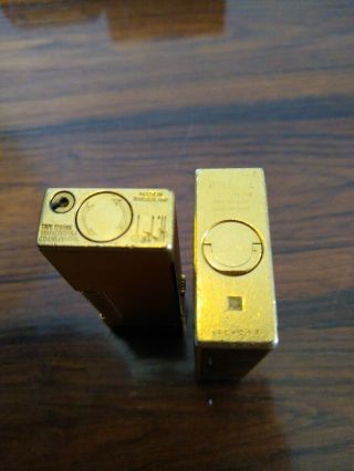 ST DUPONT LIGHTER LINE 1 LARGE GOLD LACQUER & DUNHILL ROLLAGAS GOLD.  BOXED. 7