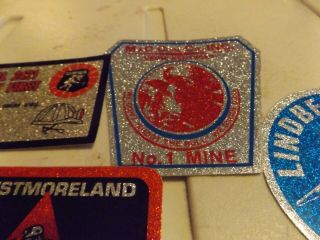 25 different old mining stickers,  they all shine 5