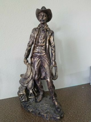 Western Cowboy With Saddle Statue 18 Inches Tall,  Resin,