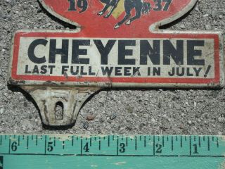 Good orig cond WYOMING dated 1937 CHEYENNE FRONTIER DAYS license plate topper WY 3
