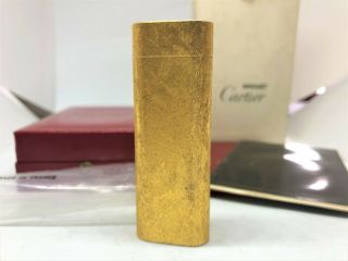 Auth Cartier Gold - Plated Brushed Bark Pattern Oval Lighter Gold W Case & Papers