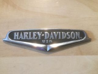 Pre Owned Harley Davidson Metal Logo With Stick On Back.  6.  5” L X 2” H.