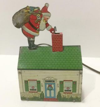 Rare Vtg Metal Mechanical Santa Claus On Toy House Roof C.  1950 