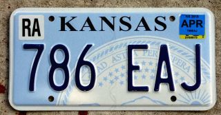 Blue And White Kansas " State Seal " License Plate With A 2015 Sticker
