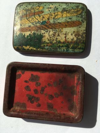Early aviation tin box c.  1908 showing the Wright Flyer airborne.  Coloured metal 2