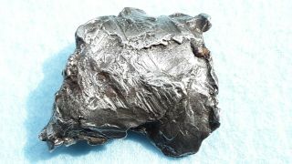 meteorite Sikhote - Alin,  Russia,  regmaglypted individual 81g with flow lines 3