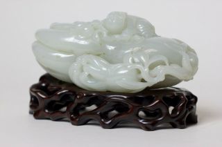 Chinese carved white jade Buddha ' s hand and figure resting on top,  China 2