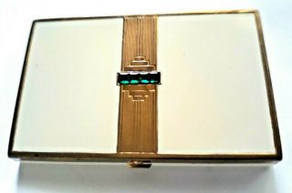 Vintage Art Deco Ivory Enameled Vanity Compact With Green Stones.