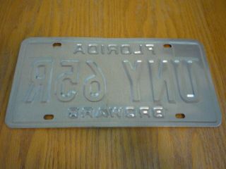 Florida license plate UNY 65R Expired 1999 3