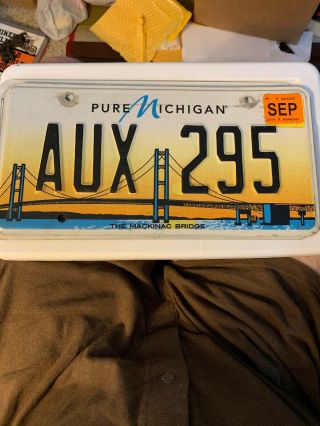 Pure Michigan License Plate Featuring Mackinac Bridge.  Aux 295 - Expired.