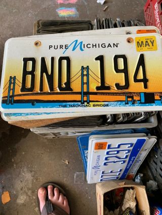 Pure Michigan License Plate Featuring Mackinac Bridge.  Bnq 194.  Used/expired