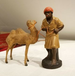 Early 1900s Camel Tender,  Rope,  With Composition Camel.  German.