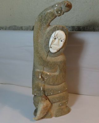 Wonderful Inuit Fossilized Whale Bone Sculpture Man With Fish Signed