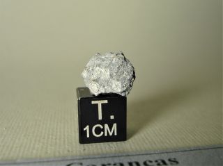 meteorite Carancas,  chondrite H4 - 5,  fresh fragment 1,  01 g,  crater maker 2