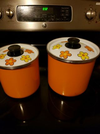 Vintage Enamel Storage Canisters Brightly Decorated With Daisies.