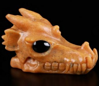 5.  2 " Orange Calcite Carved Crystal Dragon Skull,  Black Obsidian Eyes,  Healing