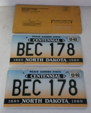 License Plate Pair 1992 North Dakota Peace Garden Centennial & Paper Jacket Bec