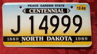 North Dakota 1989 Centennial License Plate,  J 14999,  Quality