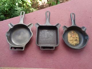 Three DIFFERENT Antique Griswold Cast Iron Ashtrays One with LABEL 5
