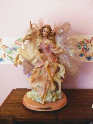 Figurine Of A Fairy/angel Riding A Unicorn