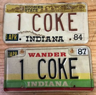 Two Indiana Issued Vanity Plates " 1 Coke " Coca Cola Soda 1984 1987 Cocaine Drugs