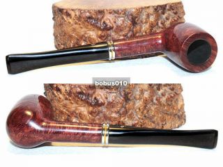 Peterson ' s Irish Whiskey 15.  Long billiard,  smooth.  Irish briar pipe 6