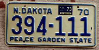 1970 Blue On White North Dakota License Plate With A 1973 Sticker