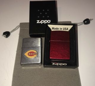 (2) Zippo Lighters One Is A Red Lighter The Other Is A Cincinnati Reds