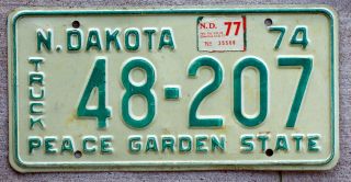 1974 Green On White North Dakota Truck License Plate With A 1977 Sticker