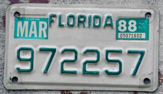 Green On White Florida Motorcycle License Plate With A 1988 Sticker