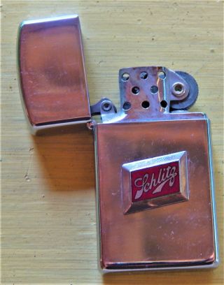 Small Zippo Cigarette Lighter W/ Schlitz Beer Emblem Affixed To Front