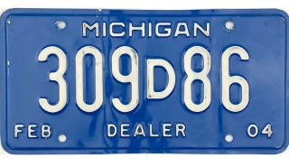 99 Cent 2004 Michigan Dealer License Plate 309d86