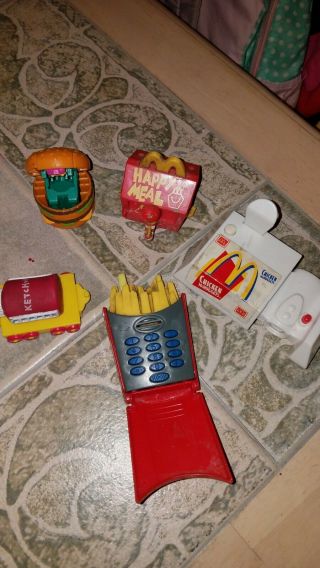 Mcdonalds register/ vintage happy meal toys,  red,  yellow,  and white items 3