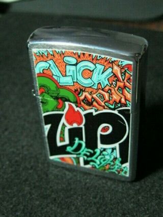 Zippo Lighter.  2004.  Brushed Chrome Sides.  Pop Art Zippo Colorful Logo