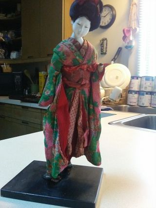 Antique Japanese Geisha Doll On A Stick With Wooden Vase