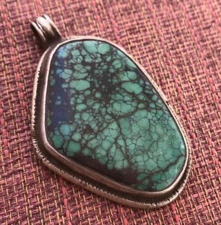 Large Oval Turquoise Pendant W/ Silver Auspicious Imagery For Dharma