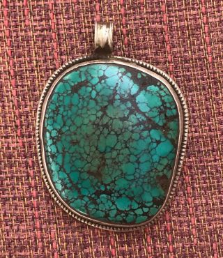 Large Oval Turquoise Pendant W/ Silver Floral Imagery For Dharma