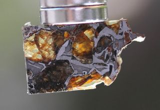 Admire Pallasite Meteorite,  1.  7 grams,  Kansas 3