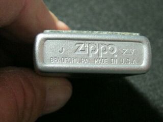 Zippo Lighter.  1999.  Plate on front of Case 