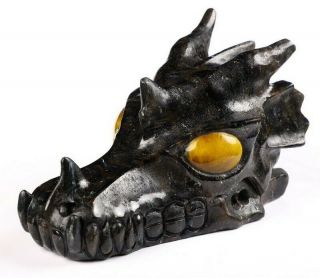 5.  1 " Russian Arfvedsonite Carved Crystal Dragon Skull,  Tiger Eye Eyes,  Healing