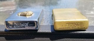 2 Vintage Zippo lighters.  70 ' s GM General Motors and 2010 brass 2